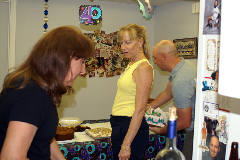 Jane, Mary and Bob ready the desserts.